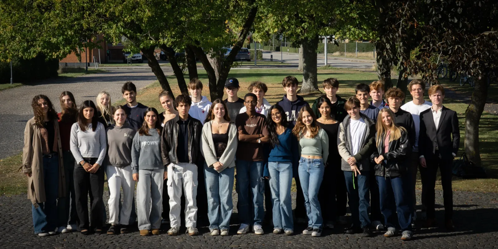 A group of students lined up outdoors after an event