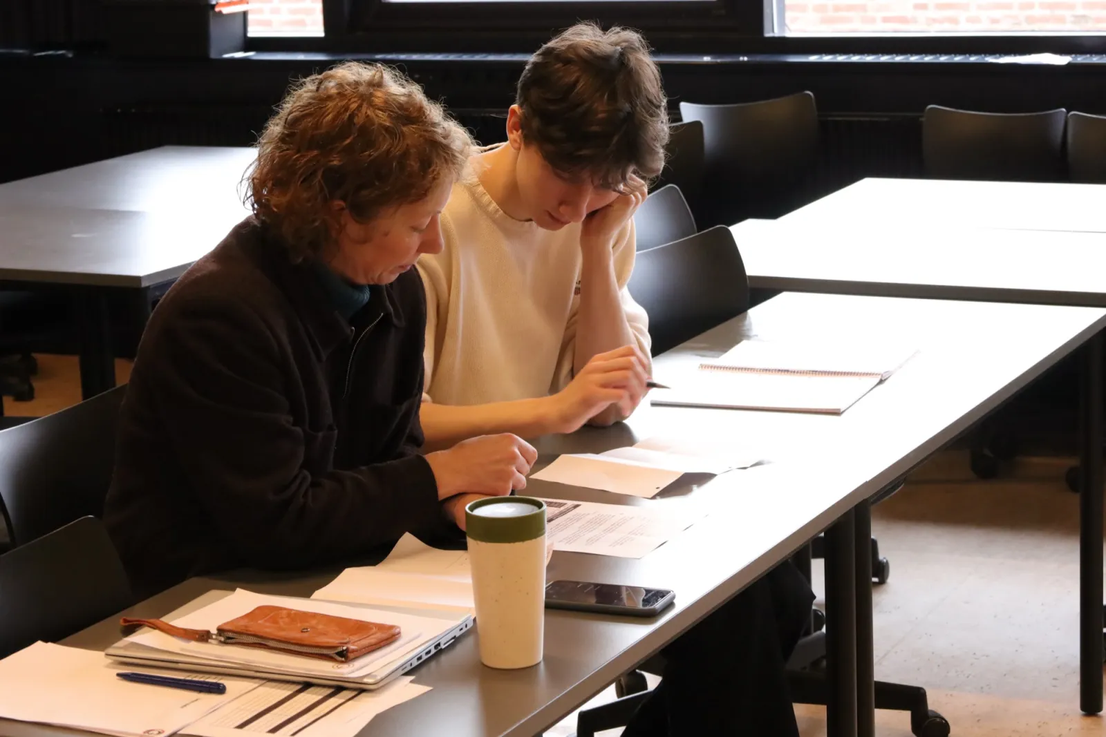 Working through a plan together at a table