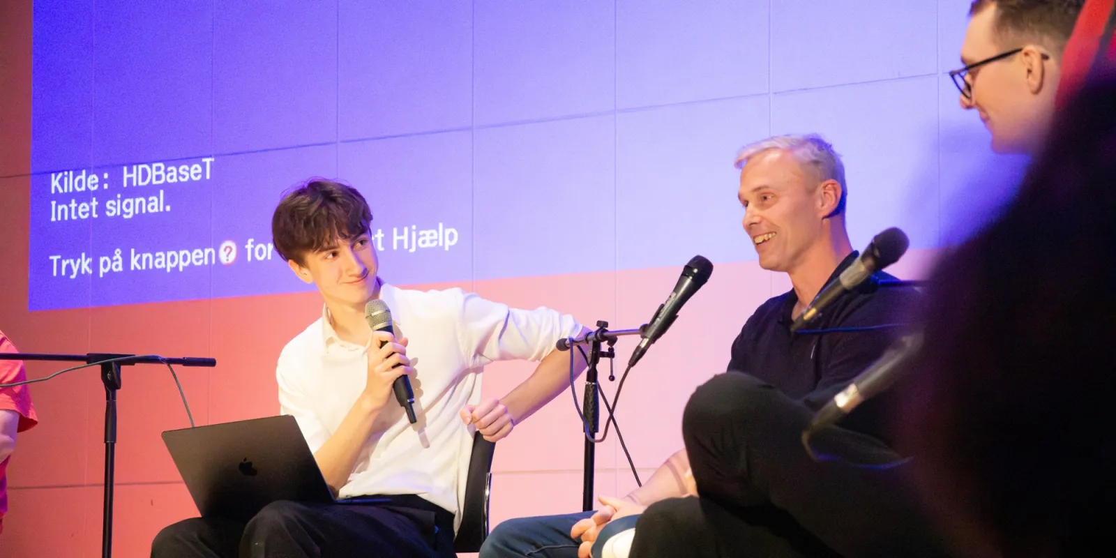 Matyas on stage in a political debate